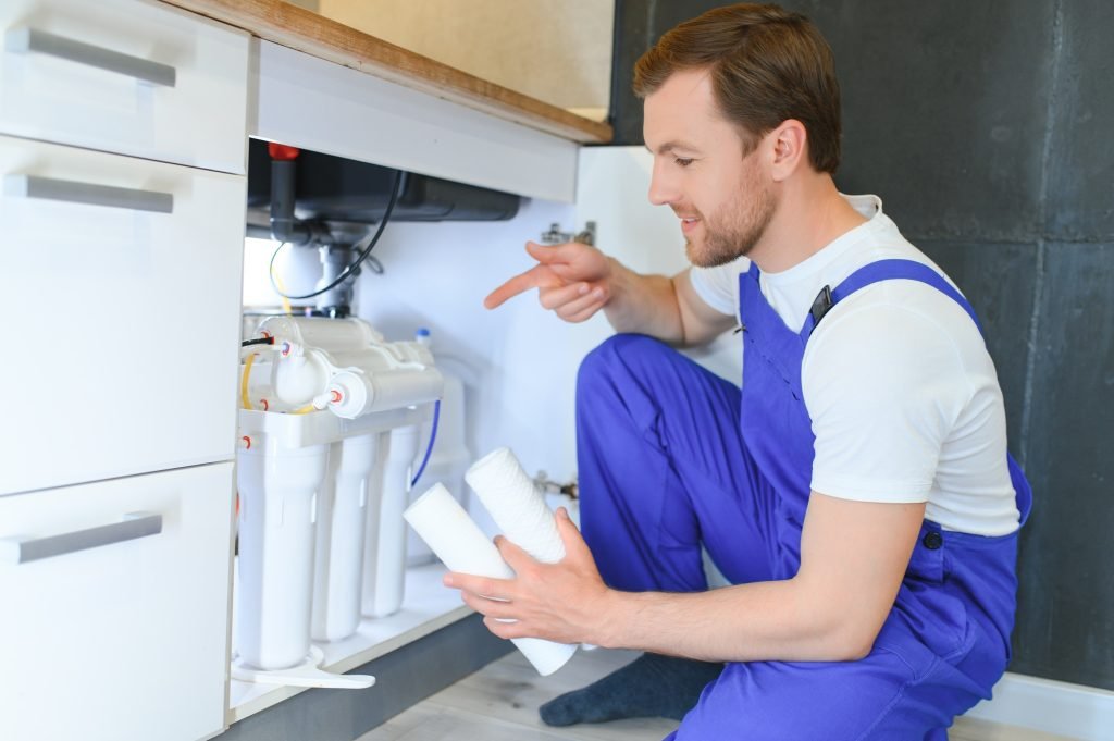 plumber change the water filter
